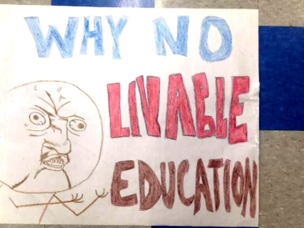 Detroit International Academy senior Hawa Rahman created protest signs, including this one. She said does not believe officials are applying enough effort towards fixing the facilities.