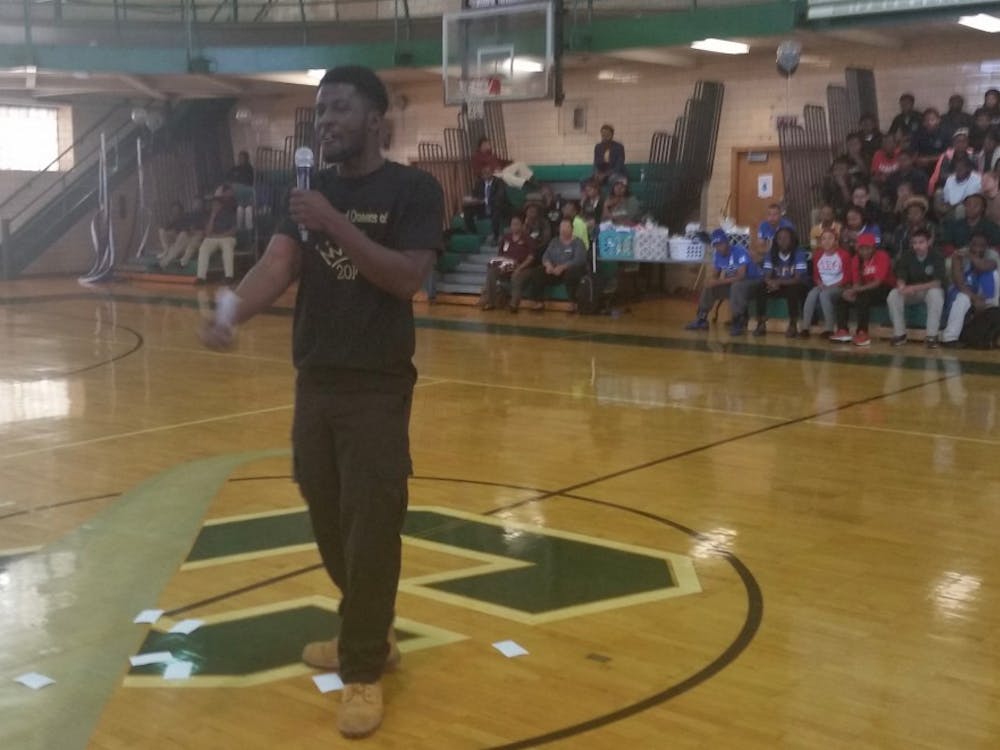 Slam poet Abdoulaye Doumbouya performs at the College Decision Day in the Cody gym on May 14. The DIT senior will go to the US Army on July 18.
