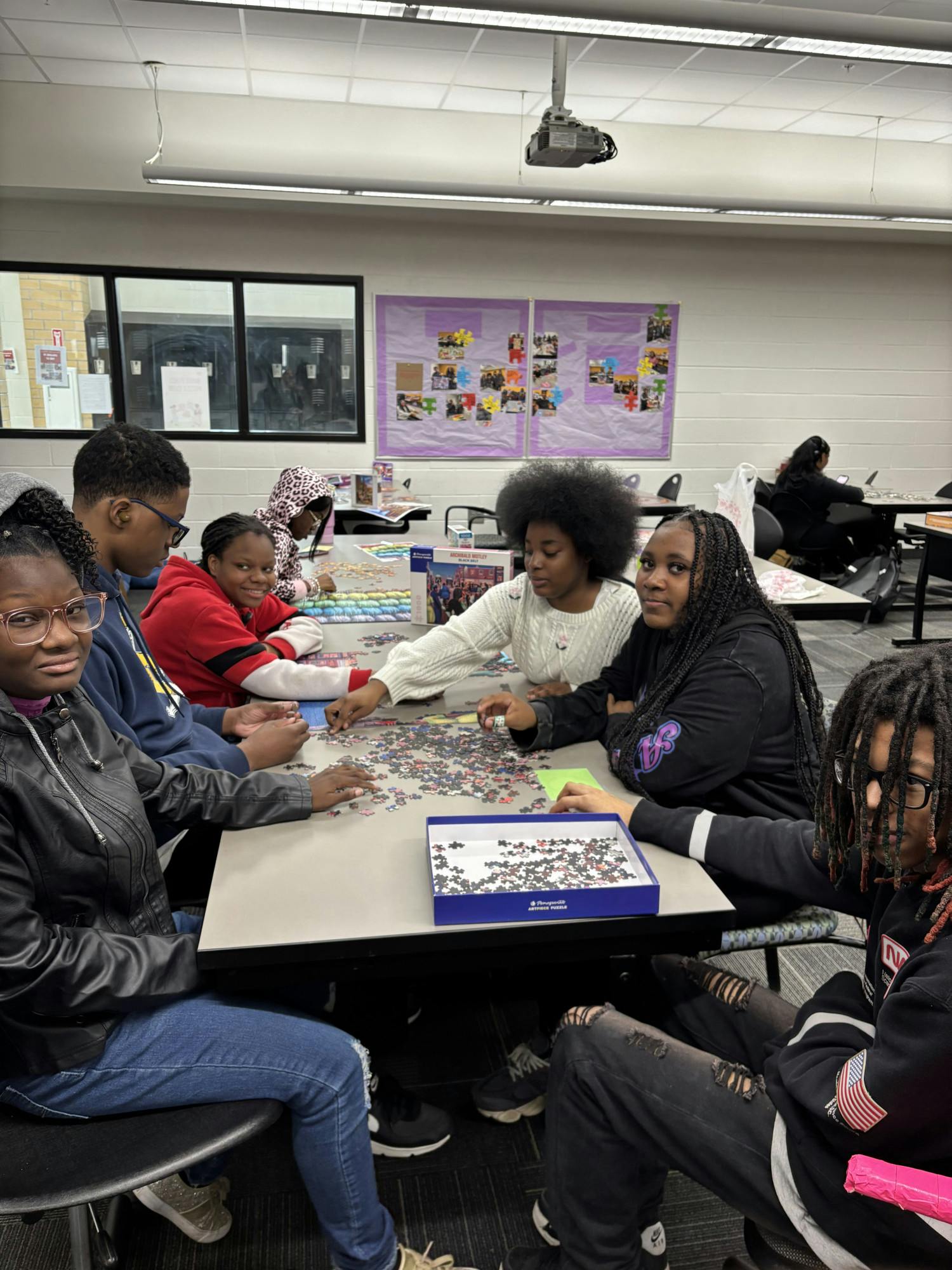 Students work on puzzles as part of the Inner Peace Puzzle Club. Courtesy photo.