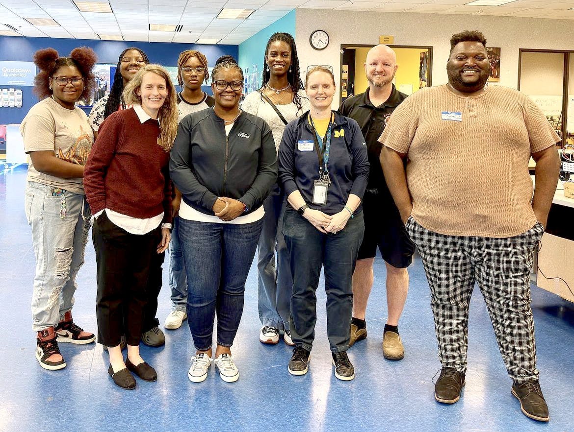 Seniors Lauren Robinson, Diamond Sewell Chiann Hamilton, and robotics teacher Carrie Russell spent time with Ford’s staff at the MEZ. PHOTO BY CRUSADERS' CHRONICLE
