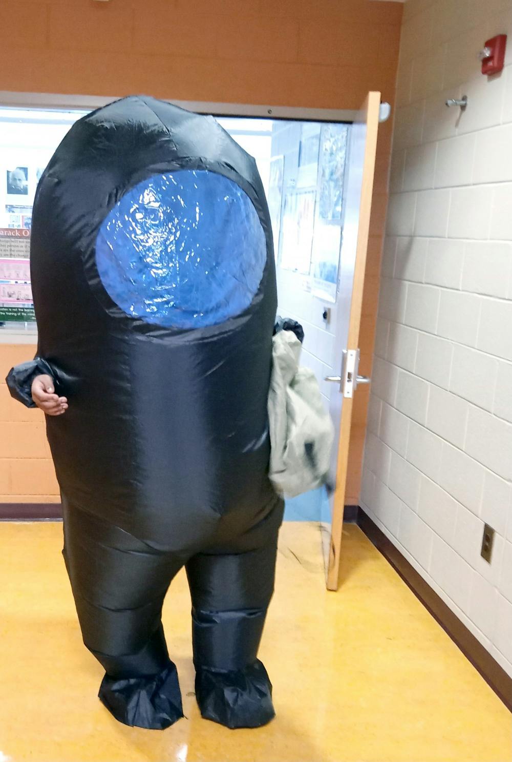 <p>Junior Braylen McConer gets ready to shed his imposter costume for his last class on Oct. 31. He had to put it on 20 minutes later for Mumford’s first annual Trunk or Treat. Photo by Leiland Kirby.</p>
