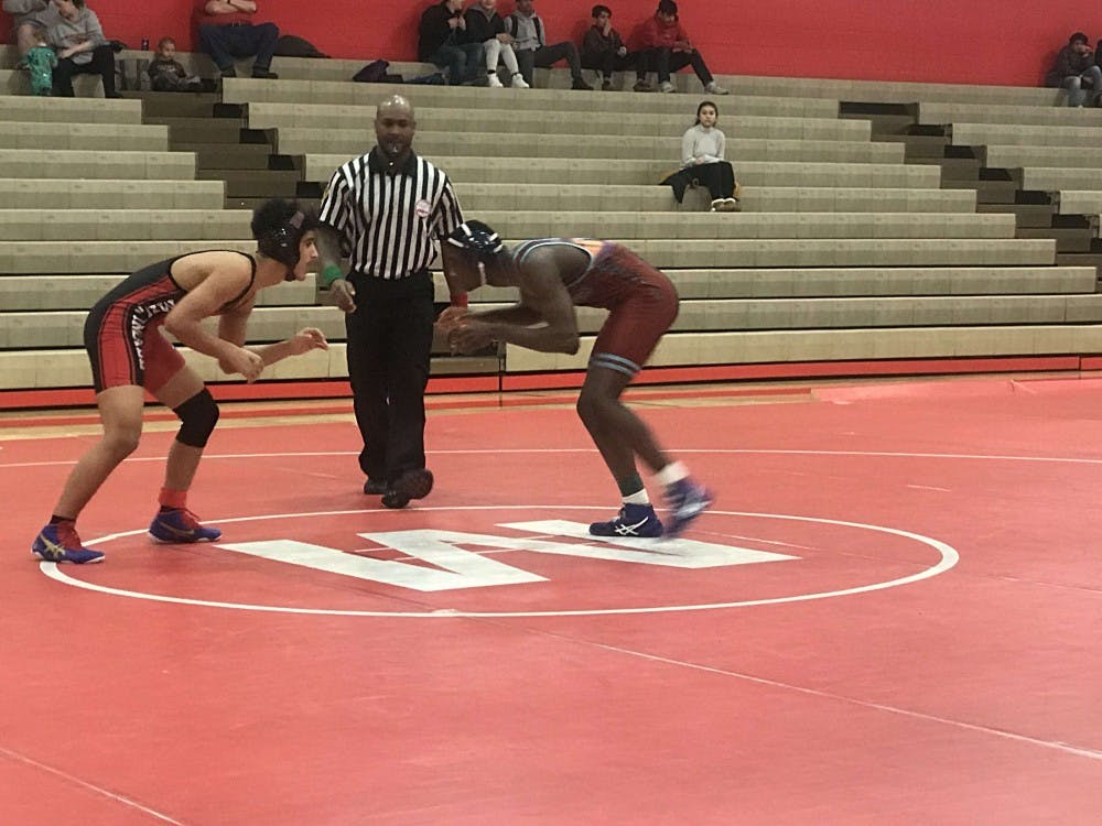 Michael Watson squares off against an opponent at a match on Feb. 8 at Melvindale H.S.