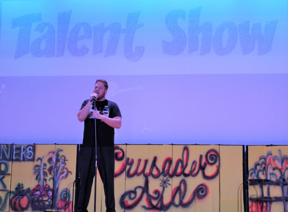 World history teacher Dan Wolford raps “MC Means Mentor the Child.”