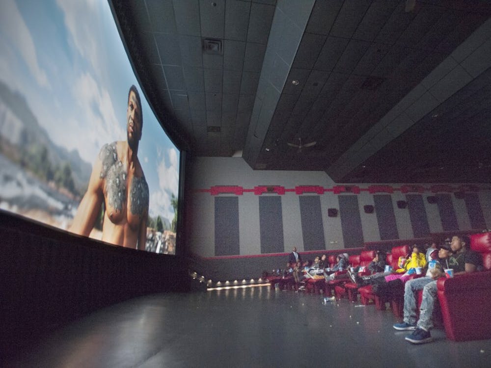 Students from three Detroit schools, including Idris Ali (lower right), 17, of Cody High School, watch Black Panther on the big screen at Bel Air Luxury Cinema in Detroit.  *** Approximately 180 Detroit public schools students and chaperones were treated to a special screening of the new Marvel Studios film Black Panther, a film with featuring a black superhero, that has done extremely well at the box office. Donations to a crowd funding initiative set up by Western International High School teacher Dorian Evans paid for the students to attend, part of the 'Detroit Black Panther Challenge.' The Bel Air Luxury Cinema on 8 Mile Road in Detroit hosted the screening on Tuesday, February 20, 2018. (John T. Greilick, The Detroit News)