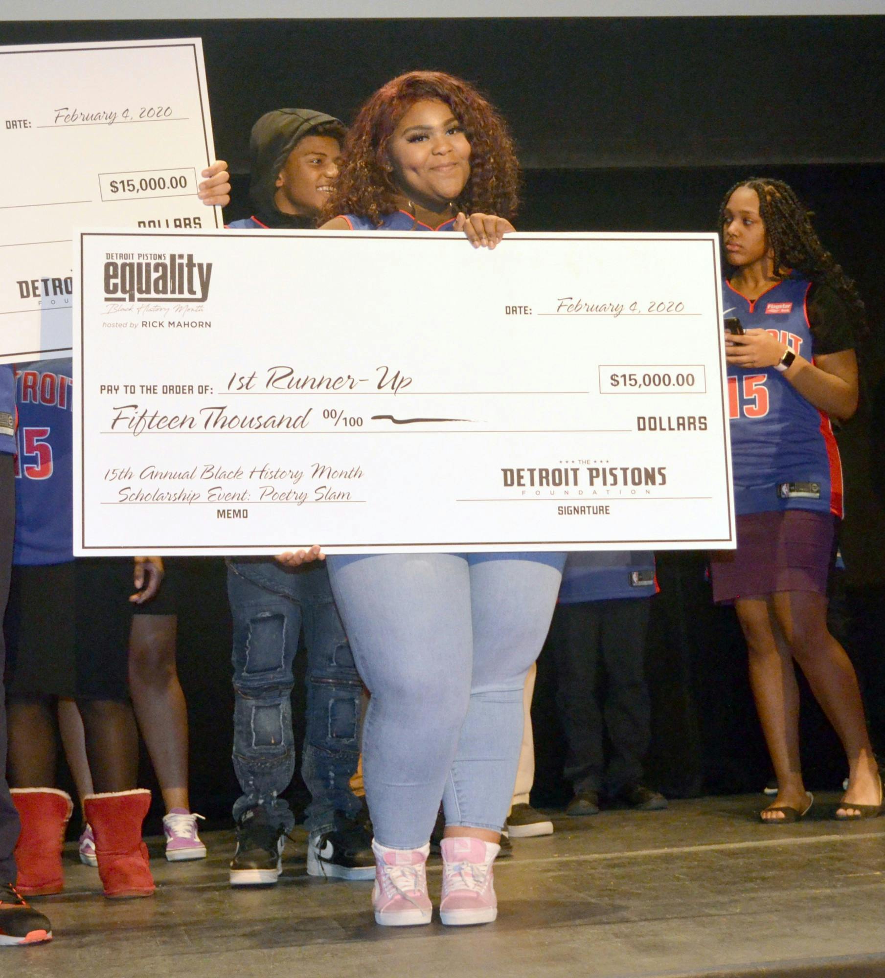 Imari Deadrick holds up second place check for the scholarship. Photo by Tyler Parker.