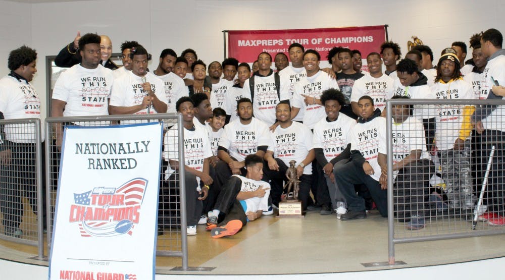 <p>The varsity football team and Coach Dale Harvel receive the 2015 MaxPreps Tour of Champions trophy for ranking No. 56 in the nation.</p>