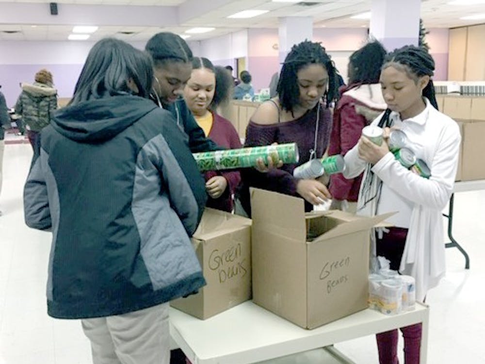 Members of the Phoenix Outreach Club filling Thanksgiving baskets for Jerry L. White and RHS families who are in need this holiday season. Photo courtesy of Develyn Newell.