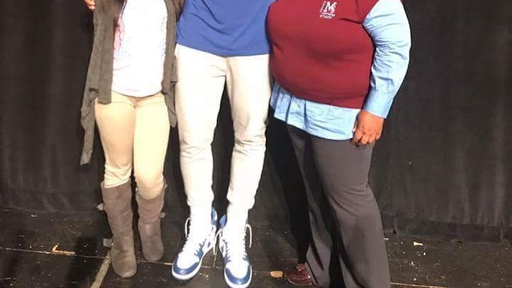 (Staff Photo/Mustang Voice) Detroit Piston Andre Drummond poses with senior Ebony Norwood and Mumford H.S. Principal Angela Prince on Oct. 24&nbsp;after awarding the school with prizes for a winning video produced by Norwood.&nbsp;