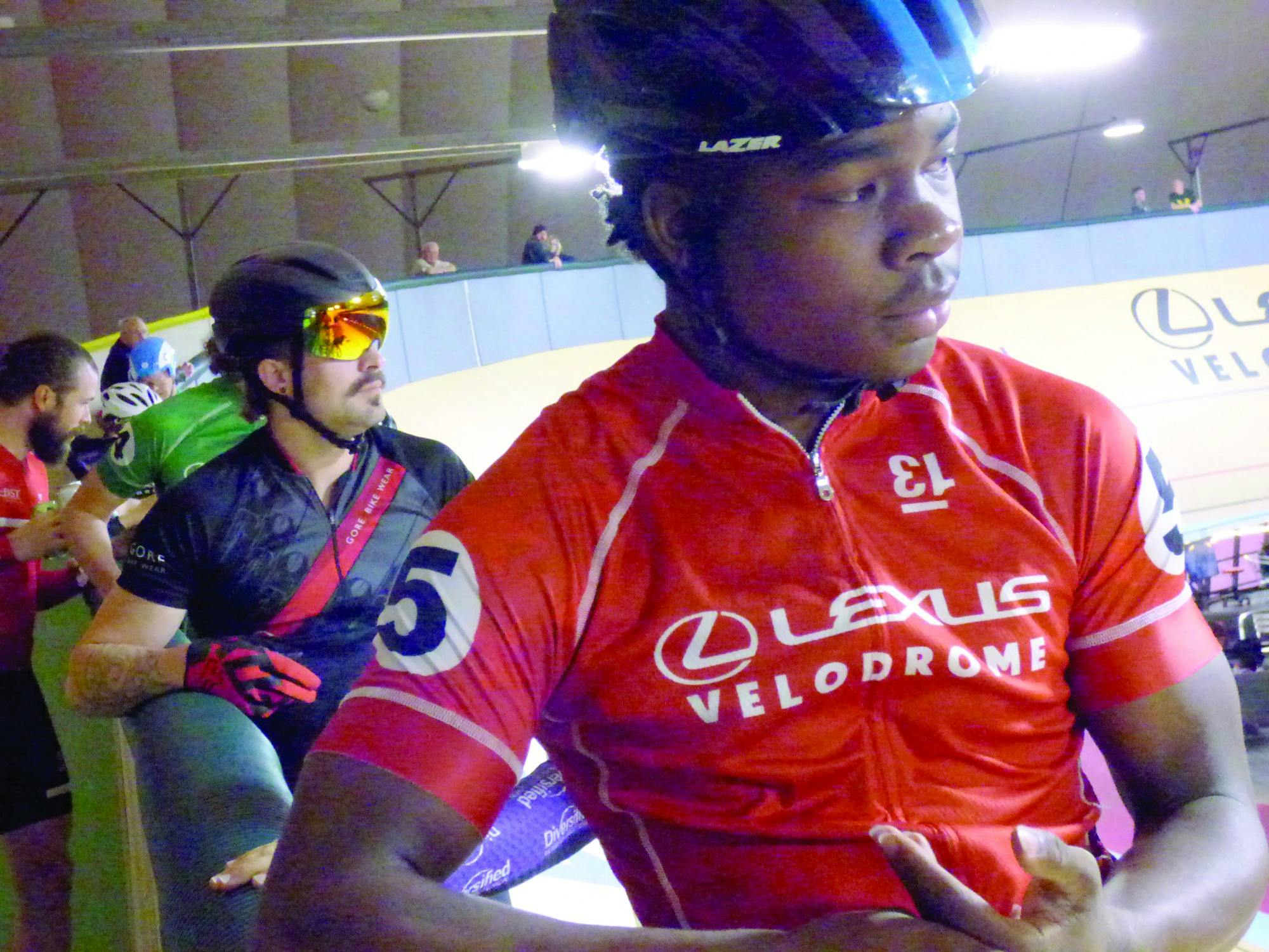 Jackson Capela listens to the official before the start of a race at the Velodrome in downtown Detroit on Oct. 26. He’s been riding competitively for two years. Photo by Logen Merritt.