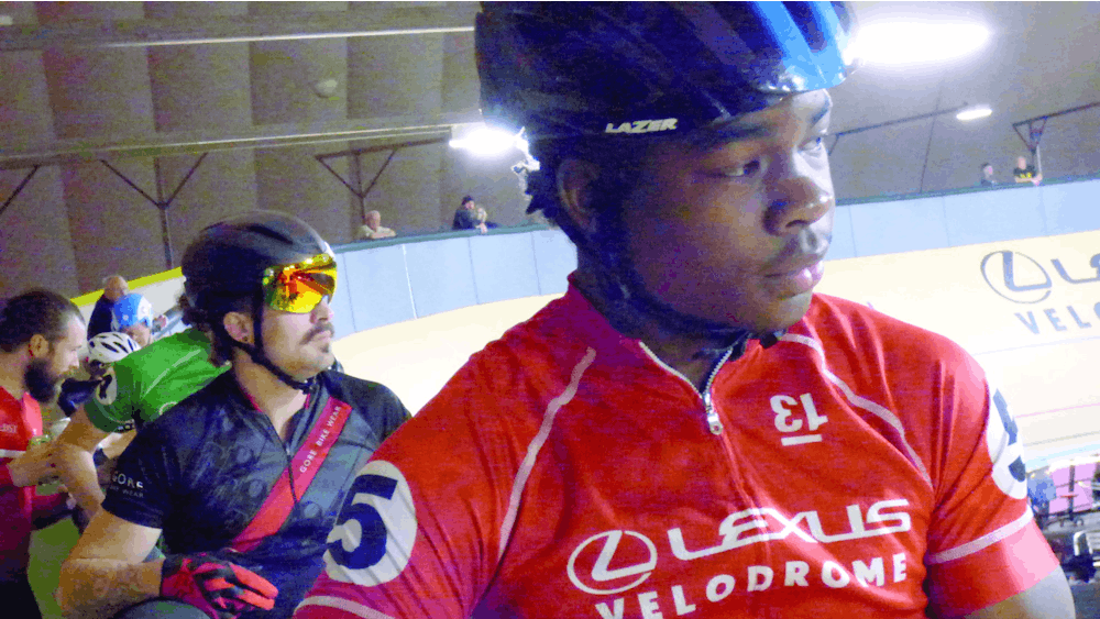 Jackson Capela listens to the official before the start of a race at the Velodrome in downtown Detroit on Oct. 26. He’s been riding competitively for two years. Photo by Logen Merritt.