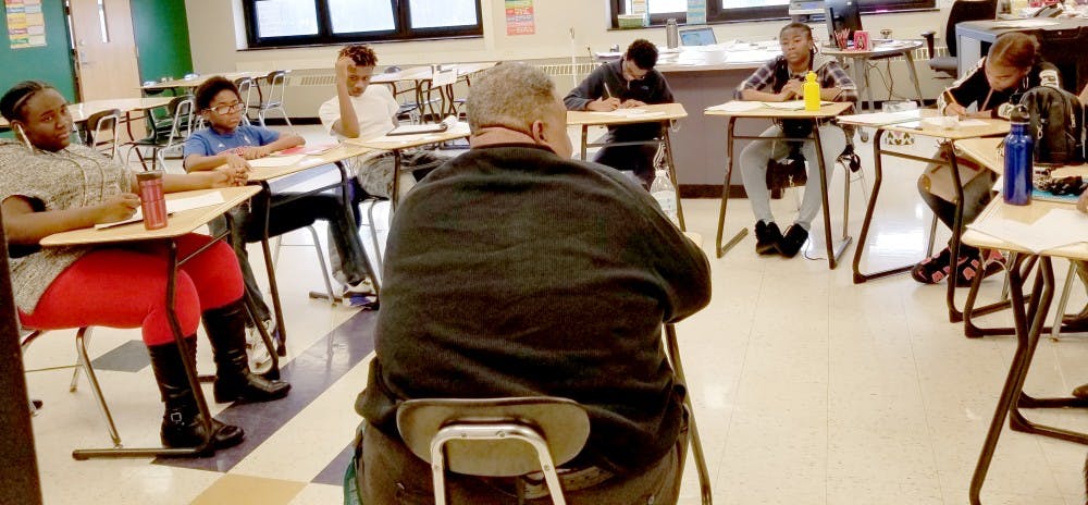 Southeastern High School Principal Maurice El-Amin with journalism students in a roundtable interview. El-Amin replaced Damian Perry, who was named principal at Mumford High School. Photo by Jacqueline Mitchell Robinson.