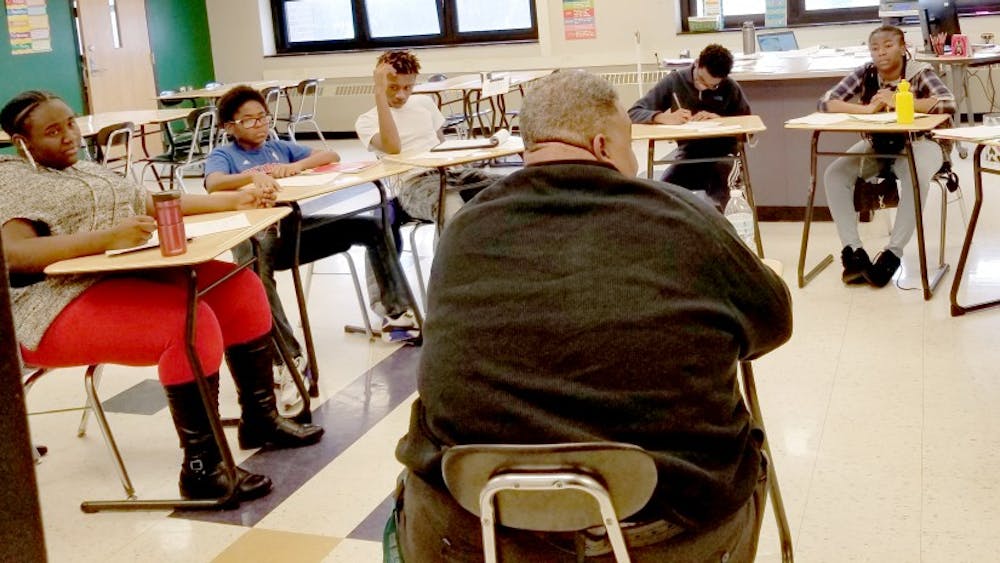 Southeastern High School Principal Maurice El-Amin with journalism students in a roundtable interview. El-Amin replaced Damian Perry, who was named principal at Mumford High School. Photo by Jacqueline Mitchell Robinson.