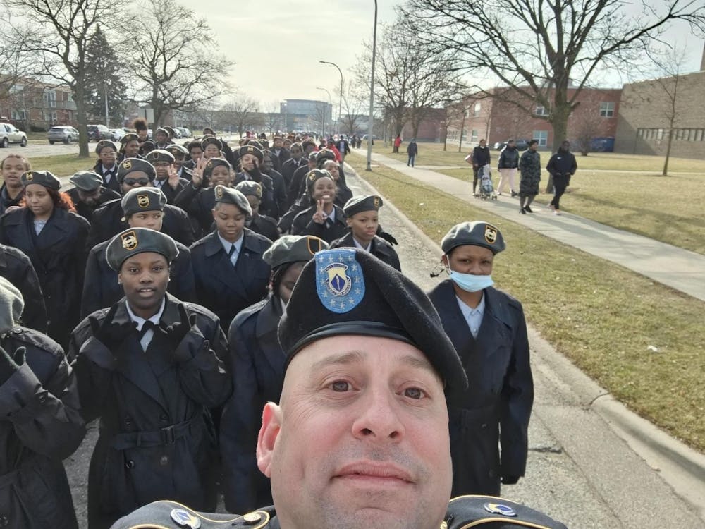 <p>First Sgt. John Hamilton takes a picture of himself and the cadets during the Martin Luther King Jr. march. Courtesy photo.</p>