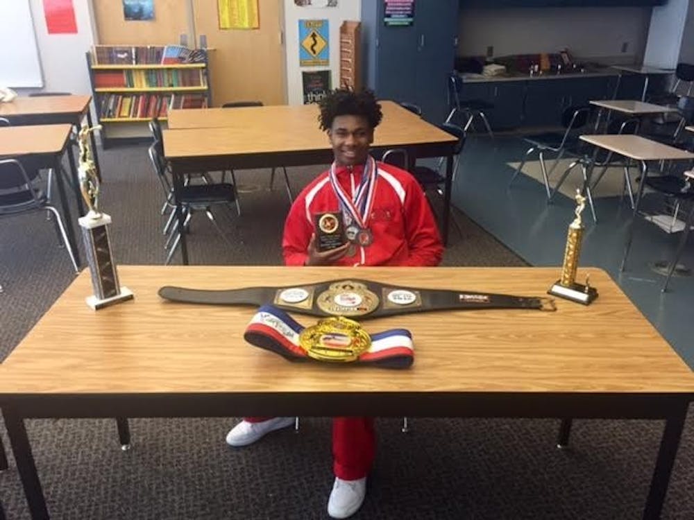 Freshman Albert Ballard displays some of his awards from his boxing matches.
