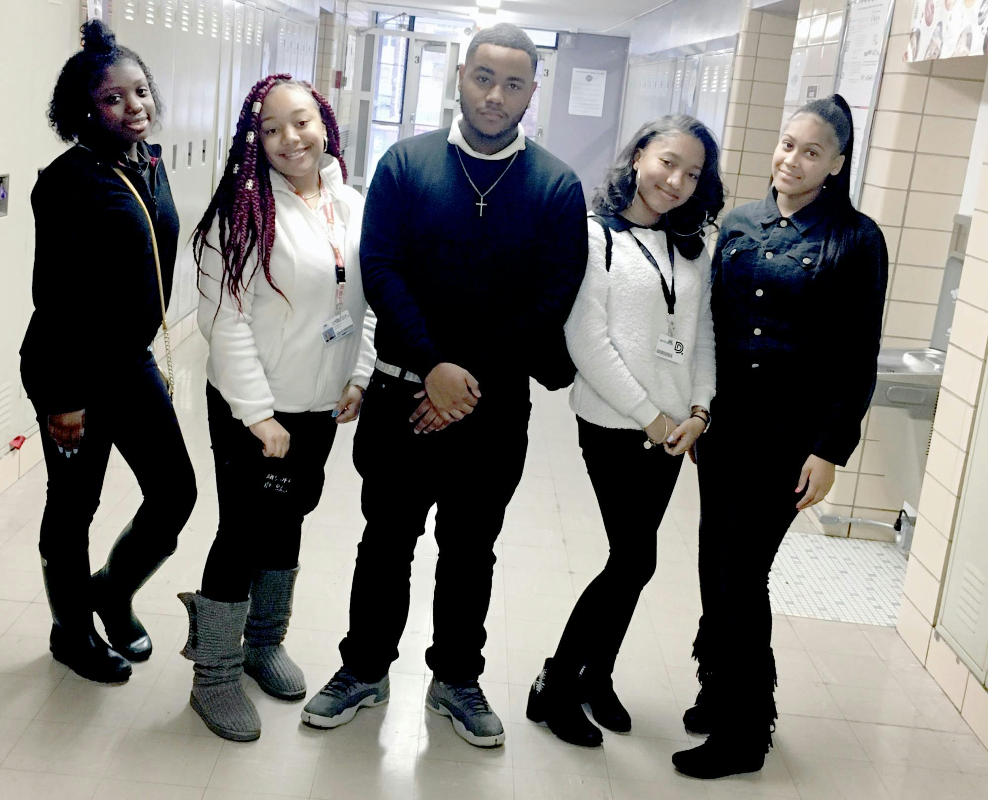 Juniors Kalen Neal, Kimberly Horton stand with senior Dy’quann Williamson, junior Jazmine Colton, and senior Corrina Coleman as they pose to show their take on school uniforms.&nbsp;