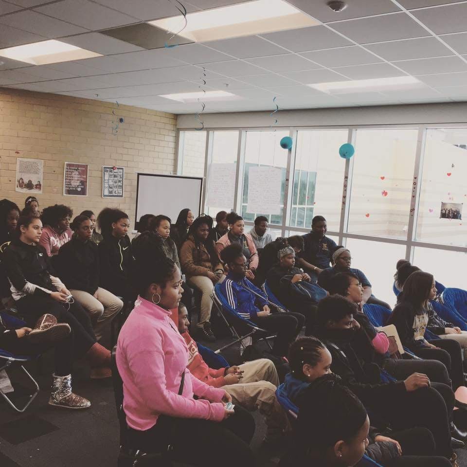 Students listen to panelist discuss methods of teen dating violence prevention.