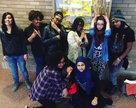 queenSpeak at Michigan’s Louder Than A Bomb 2016. Top row, (left to right): Faith Davis, Tanecea Hughes, Destiny Vernon, Jayla Arrington, supervisor Olivia Scheidler, and Alexus Bolja. Bottom row (left to right): Nikebia Brown-Joseph and Hawa Rahman.
