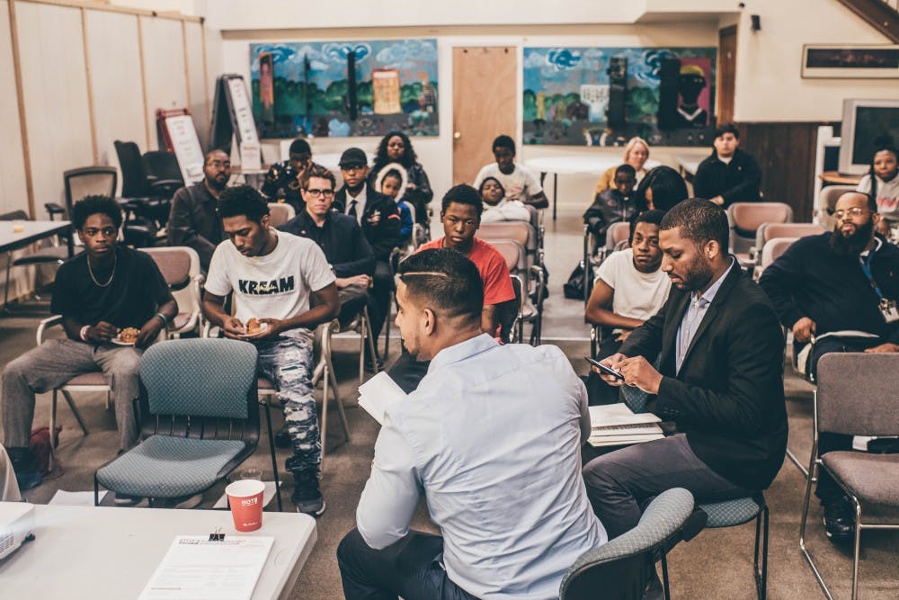 Esmat Ishag-Osman explains the political system to youth at the Matrix Center.