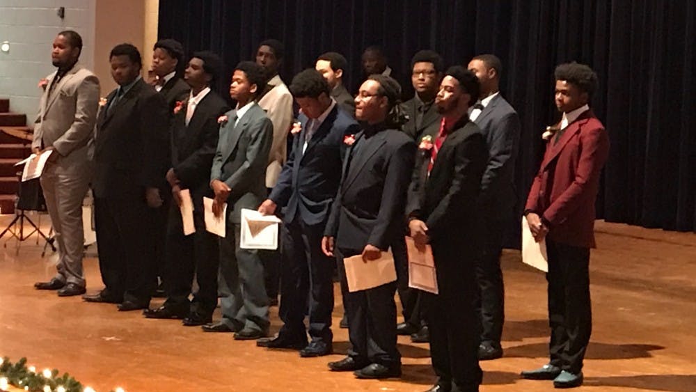 While math teacher Sean McGee calculates the judges scores for each students, the 2018 senior class at FDA were presented awards.&nbsp;