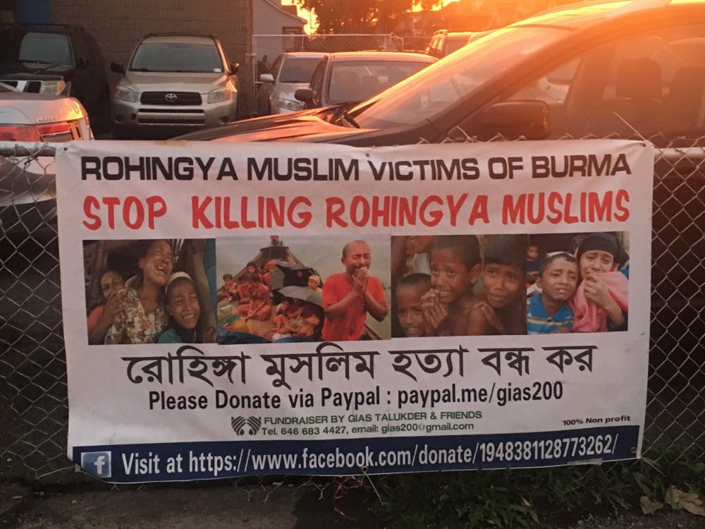 A multilingual sign in Hamtramck protests treatment of Rohingyas.&nbsp;