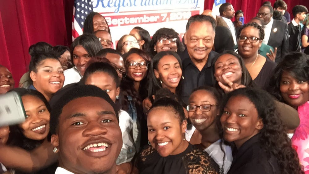 Principal Lisa Phillips and civil rights activist Jesse Jackson take a&nbsp;selfie with Cass Tech seniors&nbsp;following his inspiring speech during Cass Tech's National Registration Day Rally on&nbsp;Sept. 7.