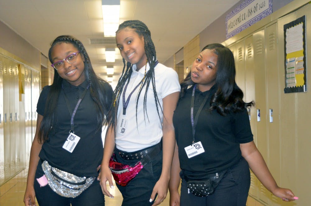 <p>Sophomores line up to show off their fanny packs. Right to lefft: Aniya Carter, DeAsia Holmes and Ch’miya Curley.</p>