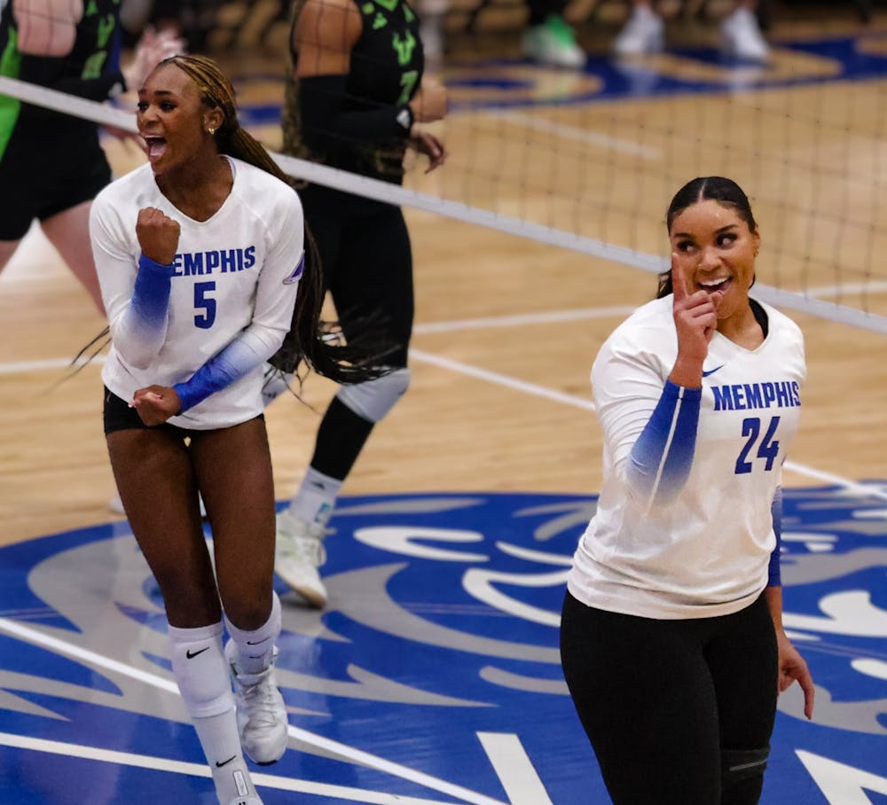 <p>Memphis&#x27; Brianna Washington (5) and Jasmyn Tate (24) celebrate a point in the Tigers&#x27; defeat to South Florida at Elma Roane Fieldhouse Sunday afternoon.﻿</p>