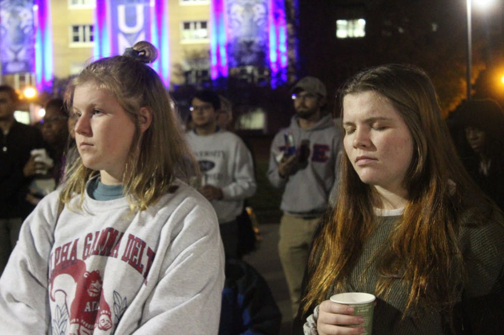 <p>During the "speak out" portion of the event, two students listen as someone shares their story of sexual assault. Other students listened and showed support to those sharing.&nbsp;</p>
