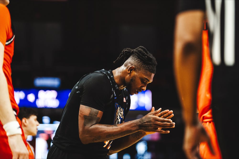 Dain Dainja claps for his teammates in Memphis' come-from-behind win at Virginia.