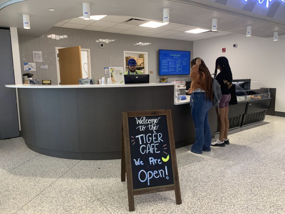 <p>A pair of students in line at the Tiger Café. Students can scan the QR code on the counter to find nutrition facts and recipes for items on the menu. // Photo: Taylor Ann Carpenter&nbsp;</p>
