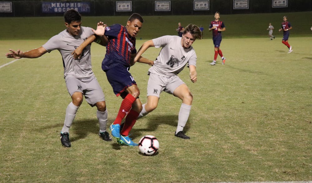 <p class="p1"><span class="s1">David Zalzman (left) and Torbjorn Rosvoll (right) keep pressure on a Belmont defender. The team saw 13 new players join this season, and Zalzman leads his team in his second year being captain.<span class="Apple-converted-space">&nbsp;</span></span></p>