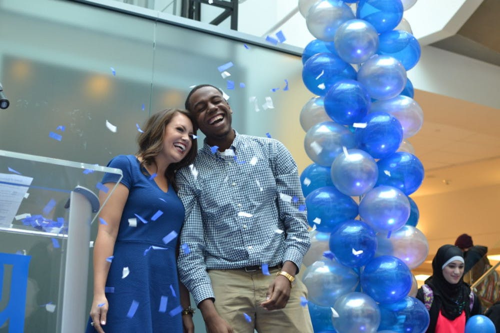 <p>The University of Memphis celebrated the hours its students put into serving the community in the University Center Atrium. David Rudd, U of M president, and wife Loretta Rudd, a clinical associate professor in child development, stand with students Melissa Byrd and Jared Moses as confetti and balloons fall from the sky light. Students did more than 600,000 hours of community service.</p>
<p>PHOTO BY Jonathan Capriel</p>