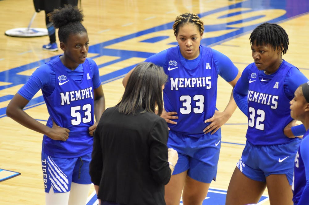 <p>Head coach Melissa McFerrin talks with her forwards #54 Lanetta Williams (left), #33 Alana Davis (middle) and #32 Dulcy Fankam Mendjiadeu (right) during a review timeout. The Lady Tigers defeated UAB 77-52 in their return to home after a three-week stretch.&nbsp;</p>