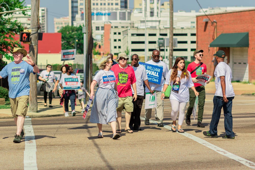 <p class="p1"><span class="s1">Supporters of Tami Sawyer and candidates of other races march down the street to support their candidate. The candidate faces a challenge against incumbent Jim Strickland former Mayor Willie Herenton.</span></p>