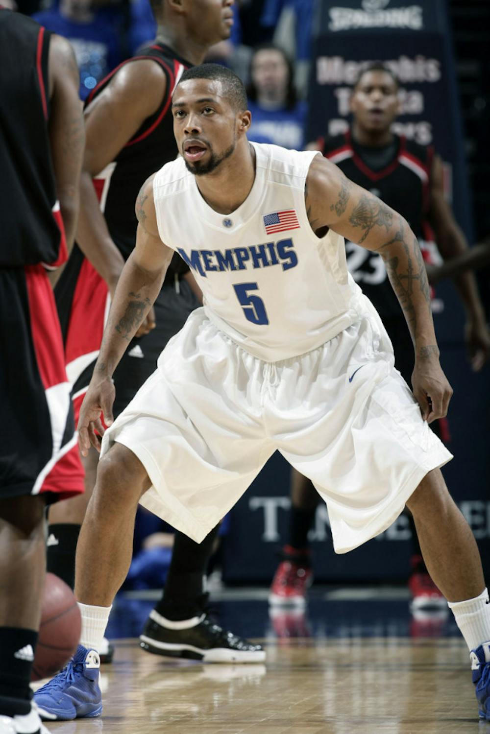 <p>Former Tigers guard Antonio Anderson gets into his defensive stance. Anderson famously hit game-winning free-throws to help the Tigers advance past Texas A&amp;M in the 2007 NCAA Tournament.</p>