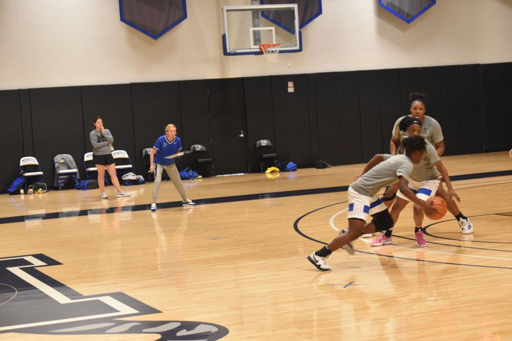 <p>Assistant Coach Abby Jump coaches a play-set during the women's basketball team's practice. She followed Head Coach Katrina Merriweather from Wright State after playing under Merriweather's tutelage.</p>