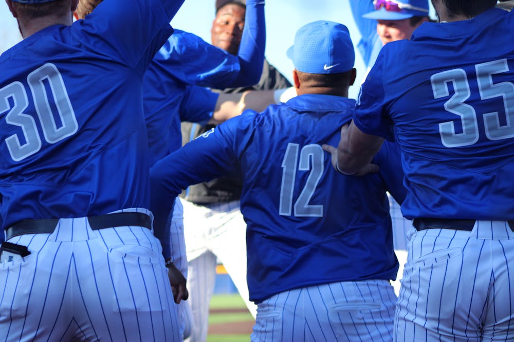 <p>The Memphis baseball team celebrates a home run. Their student managers say being a part of the team is what drives them.</p>