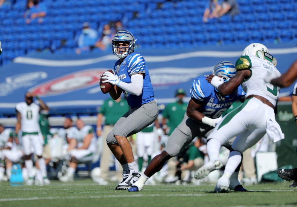 <p>Brady Whites gazes for an open receiver. White won his 24 game at Memphis with the win over USF, giving him the most wins by any starting quarterback in Memphis history.</p>