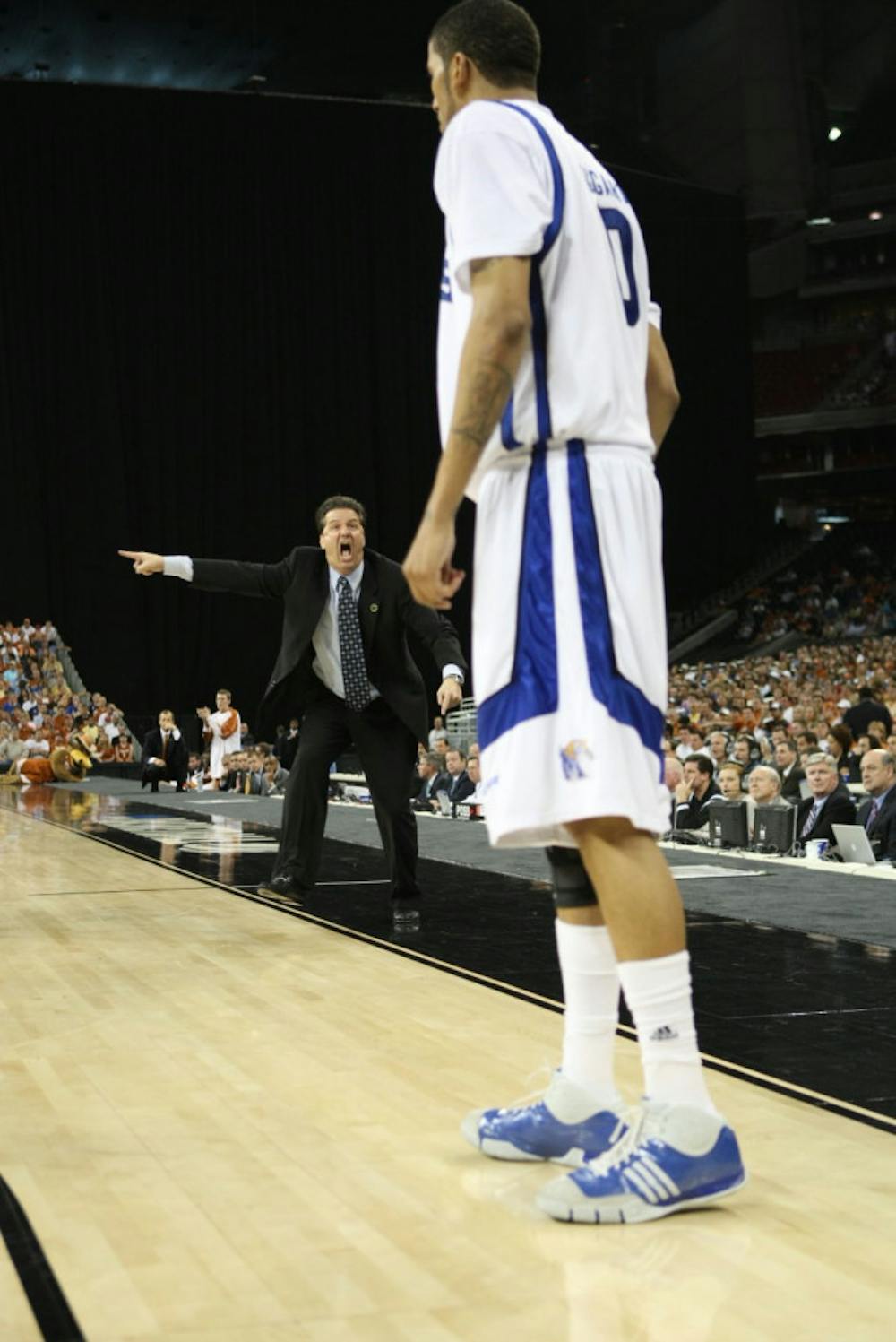 <p>Former Memphis coach John Calipari directs his players from this sideline. He is now looking for his second National Championship at Kentucky.&nbsp;</p>