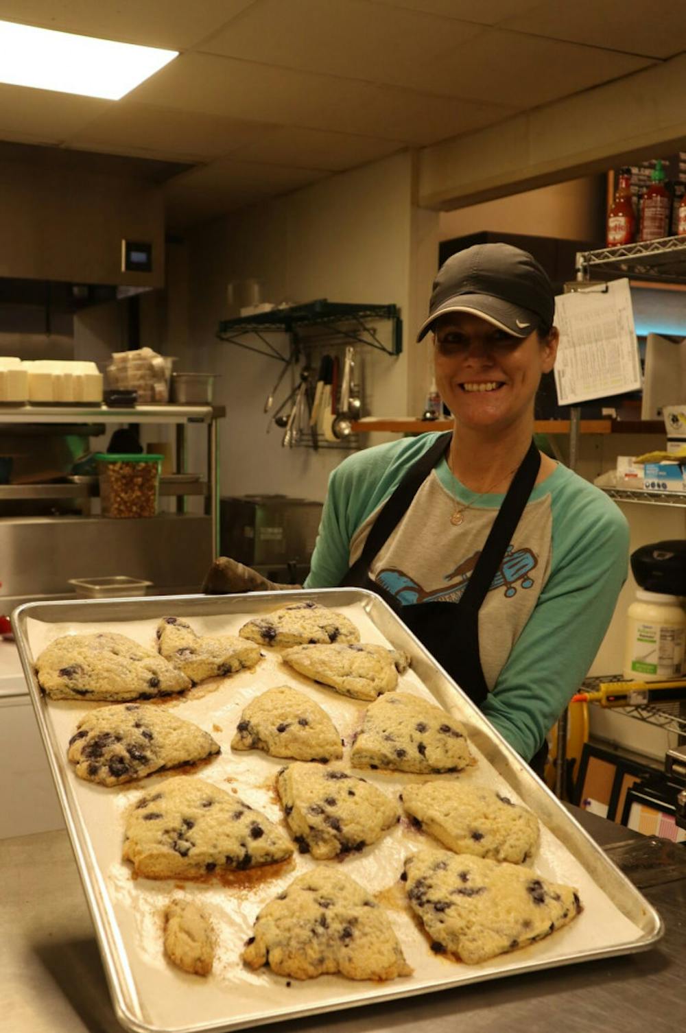<p><span>Baker Stacy Hinkle bakes four trays of blueberry-lemon scones at the Belltower Coffeehouse. “For me baking is a stress relief,” the baker and trained nurse said.</span></p>