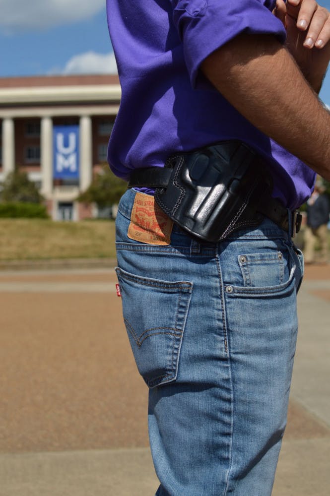 Student wears empty holster for protest