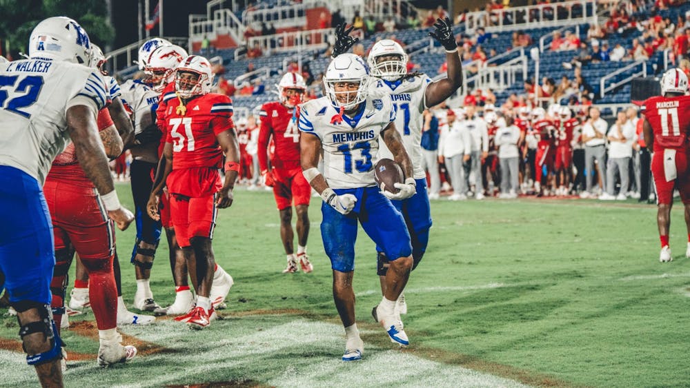 <p>Memphis running back Greg Desrosiers Jr. celebrates a touchdown in the Tigers&#x27; 55-26 victory over FAU Saturday.</p>