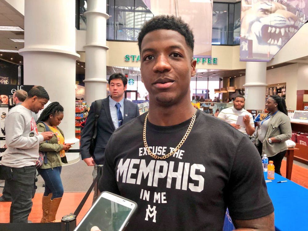 <p>Former Tiger football star Anthony Miller talks to reporters following his autograph signing at the campus bookstore. Miller finished his career as the school's all-time leading receiver.</p>