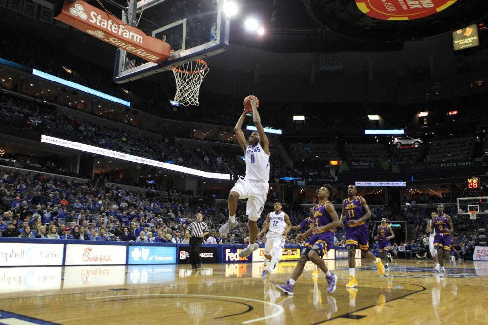 <p>K.J. Lawson leads the fast break with a dunk against ECU. He is third on the team with 12.6 points per game.</p>