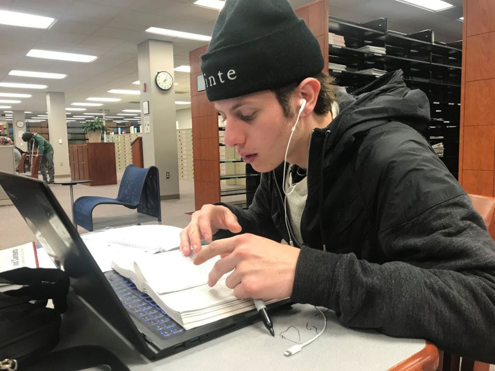 <p class="p1"><span class="s1">Wes Brown, a journalism student at the University of Memphis, studies for his Spanish final exam in the Ned R. McWherter Library. Some students may face test anxiety as they prepare for their final exams.</span></p>