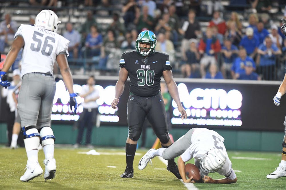 <p>Brady White (3) clutches onto the ball after being sacked. White was sacked a total of seven times against Tulane.</p>