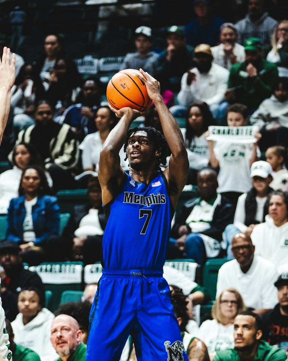 Memphis wing PJ Carter shoots a three-pointer in the Tigers 77-68 road win against Charlotte.