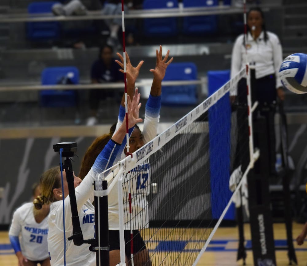<p>Two Tigers guard the net in Memphis&#x27; 3-1 victory over Chattanooga Thursday night at Elma Roane Fieldhouse in the first game of the Carrie Yerty Classic.﻿</p>