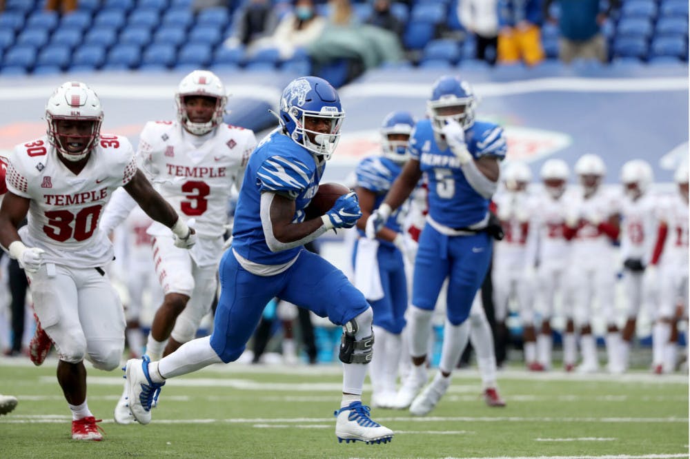 <p>Kylan Watkins storms down the field for first down against Temple. The Tigers defeated the Owls 41-29 on their homecoming game in Memphis.</p>