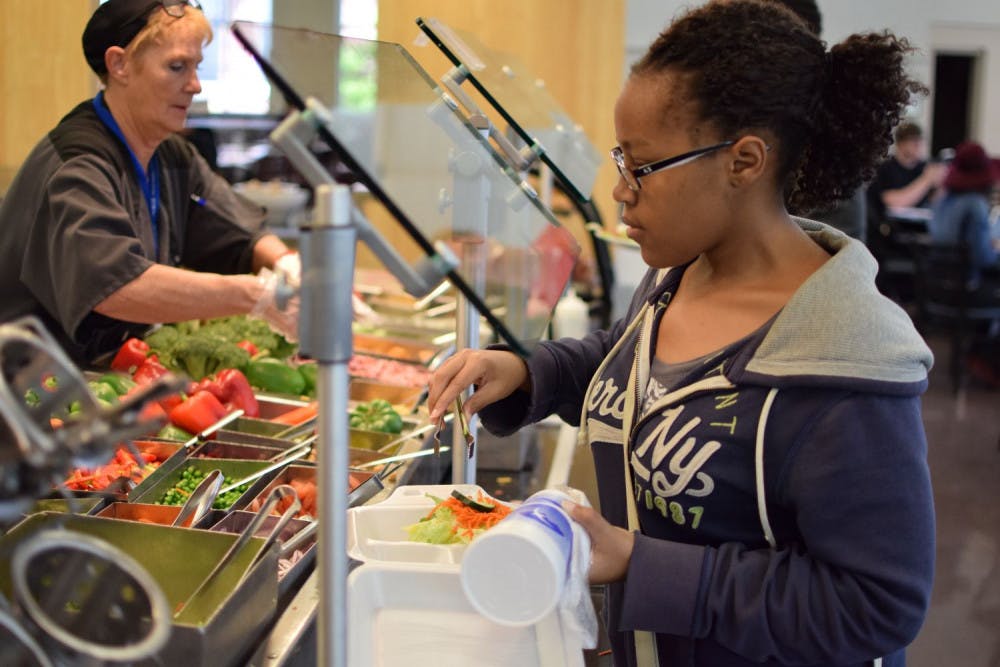 <p class="p1">Kamaria Gunn, a senior studying graphic design, ate lunch in the Tiger Den Tuesday. Recently, the cafeteria has been putting away the food around 7 p.m., even though it is supposed to serve all food until 8 p.m.</p>